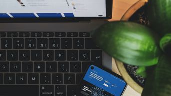 Photo Credit: https://unsplash.com/photos/QuusekRfTI8 / A computer, tablet, and plant on a desk