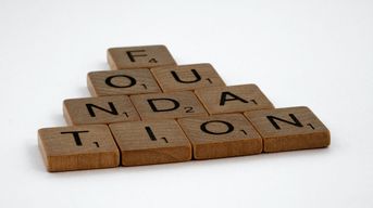 Wooden blocks that spell the word Foundation / Photo Credit: Unsplash 