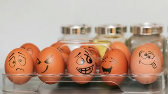 Eggs with face drawings conveying the human range of emotions.